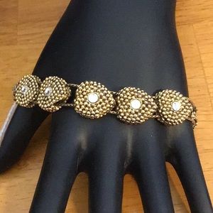 Gold tone heart shaped slide bracelet